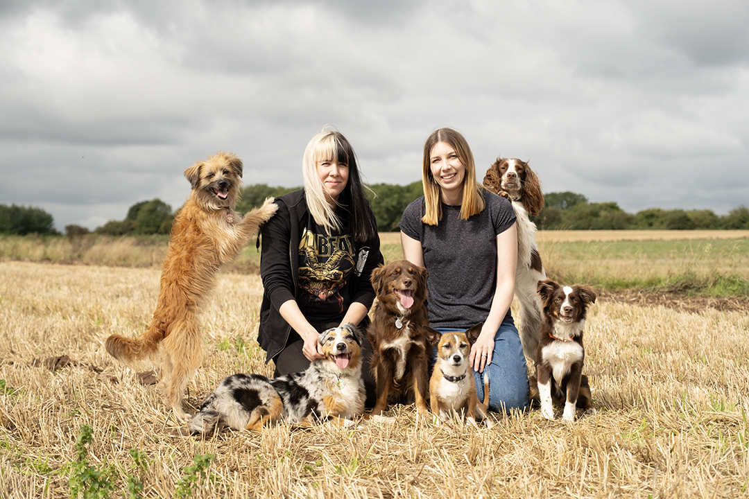 Lorraine and Amy with a group of dogs